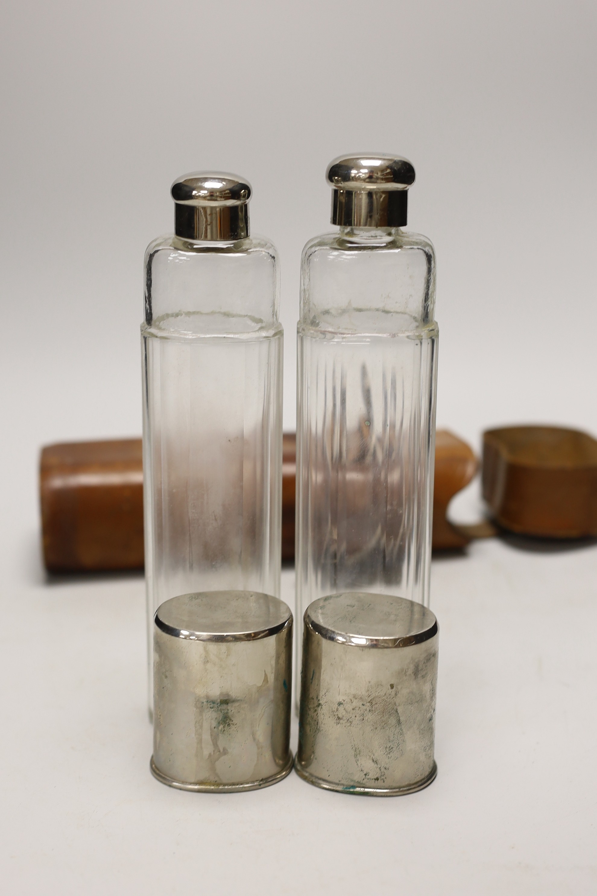 A late 19th/early 20th century leather duo travelling flask case by A. Greaves with two flasks